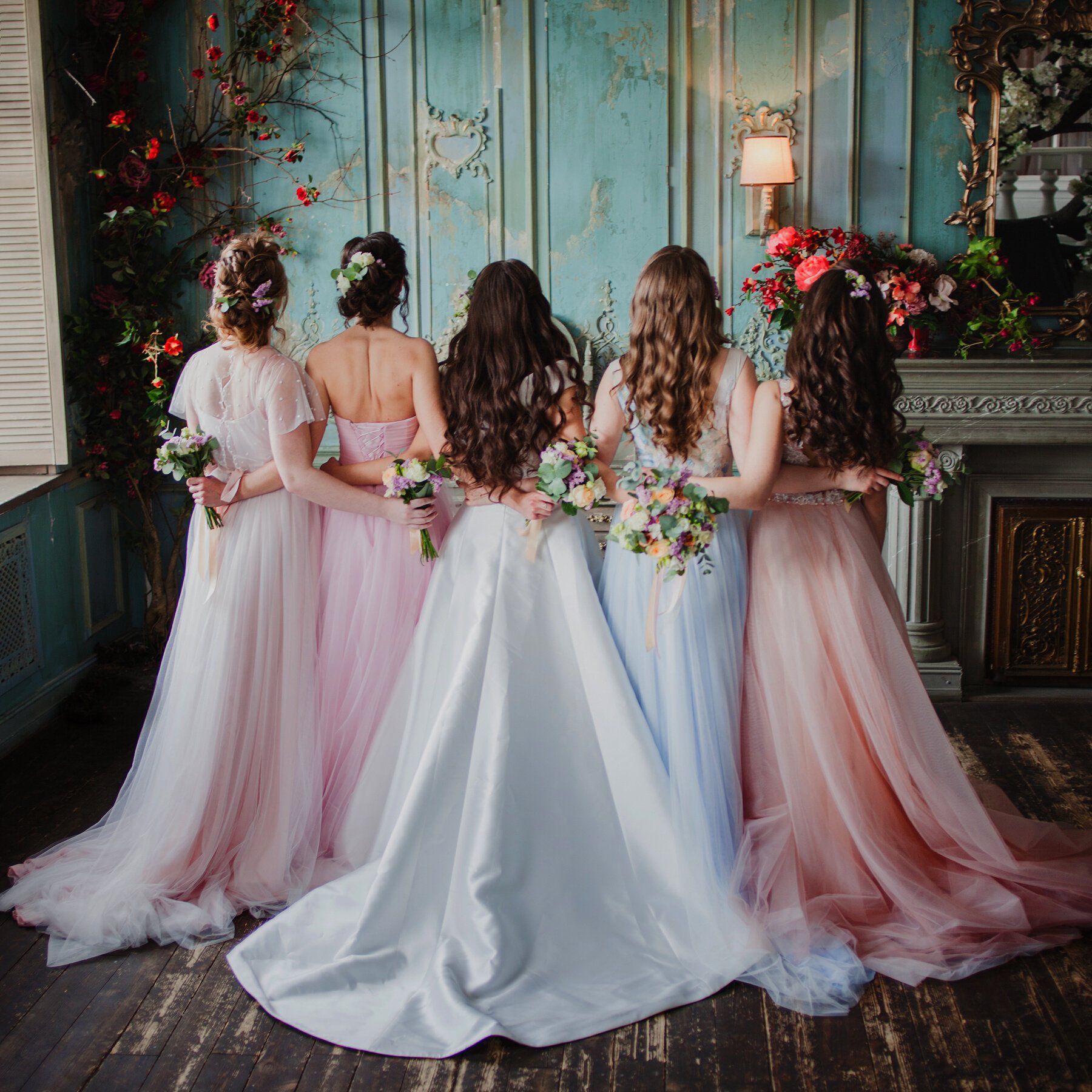 Bride and bridesmaids. Beautiful young women in dresses